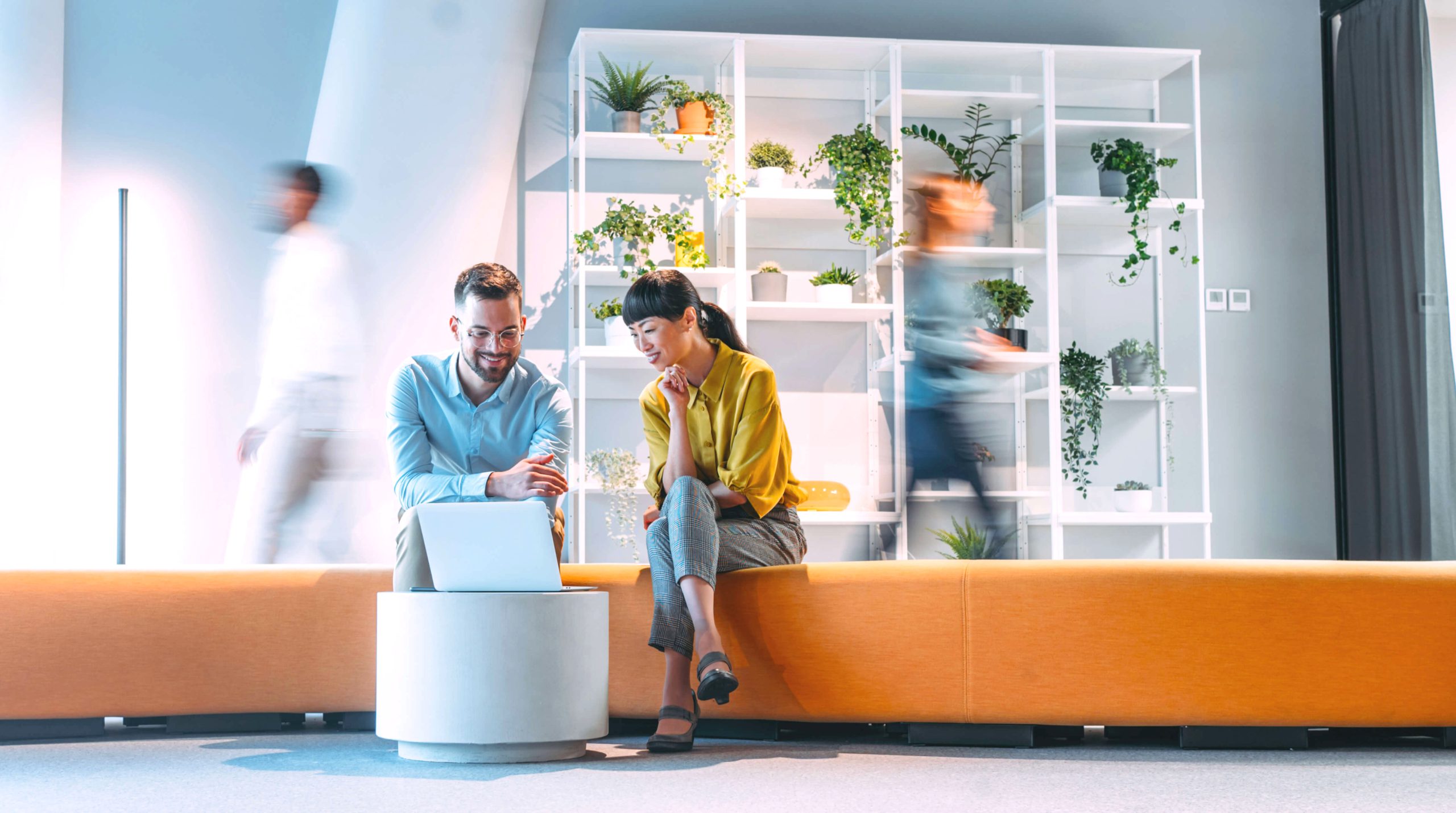 People in blurred office